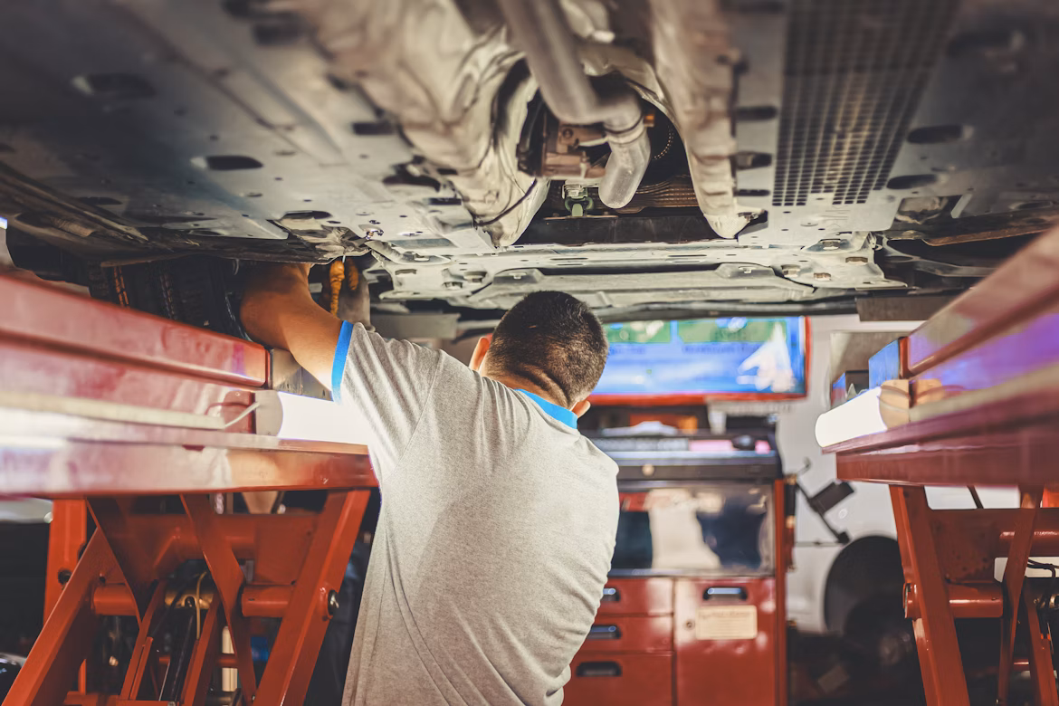 Technician Under Car